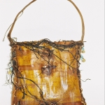 wild-cherry-bark-folded-and-side-stitched-with-peeled-cedar-roots-and-handle.jpg